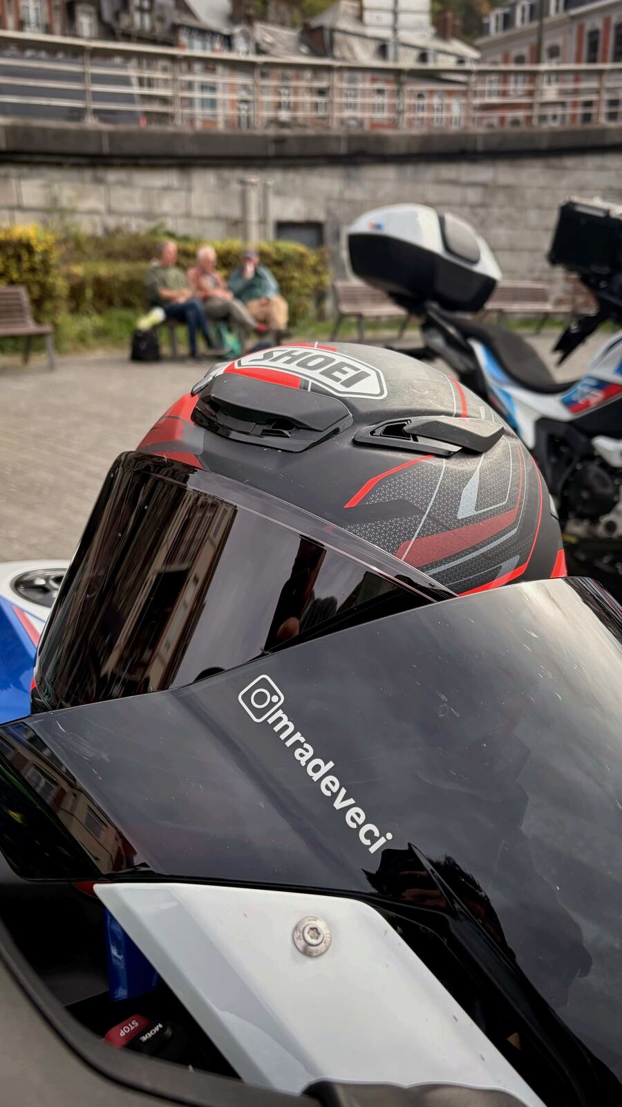 Helmet and windscreen with the citadel wall in Dinant behind