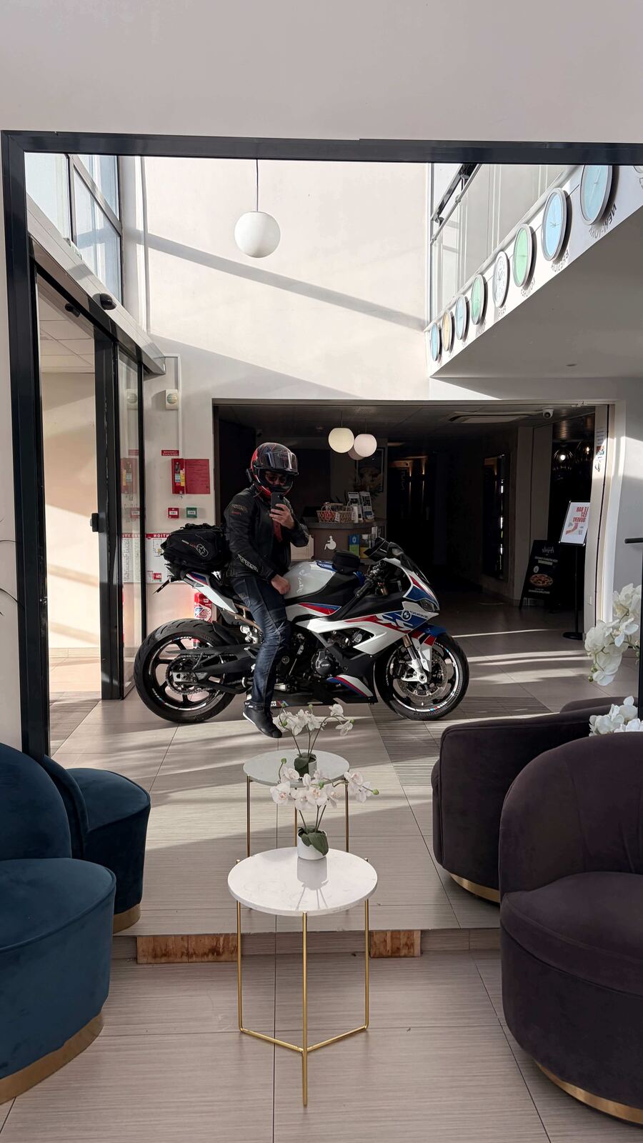 Riding the bike into a hotel lobby for a photo