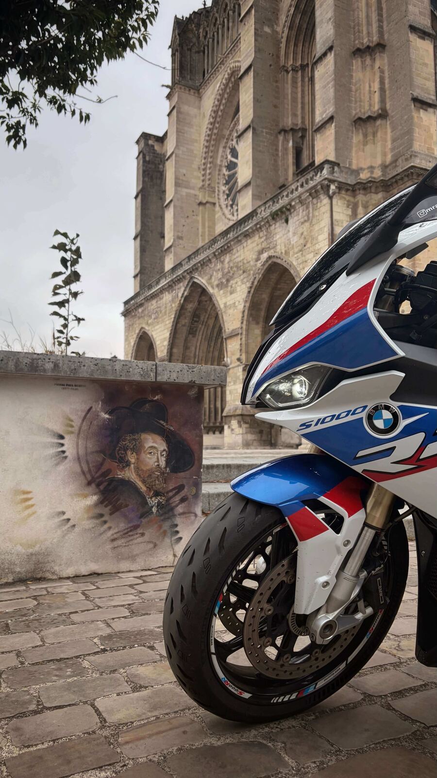 The bike parked outside a Gothic cathedral on the way south