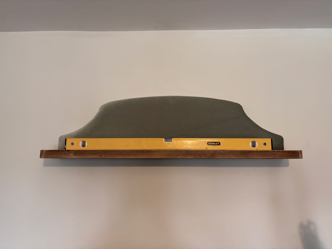 The finished shelf, checked level and mounted on the wall